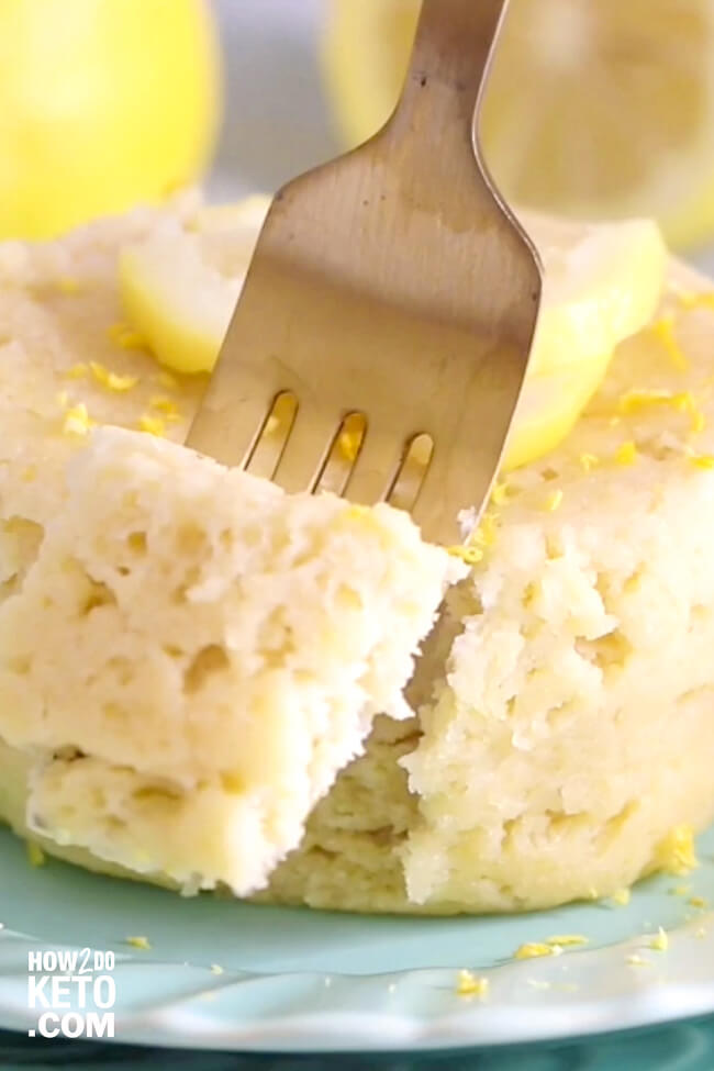 fork cutting into a piece of lemon cake