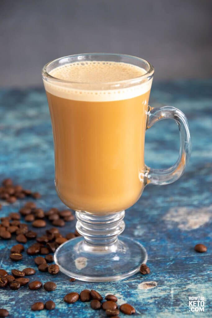 creamy bulletproof coffee in glass mug