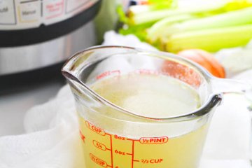 Bone broth is known for it's amazing health benefits, and now you can make it in less than an hour with this easy Instant Pot Chicken Bone Broth recipe!
