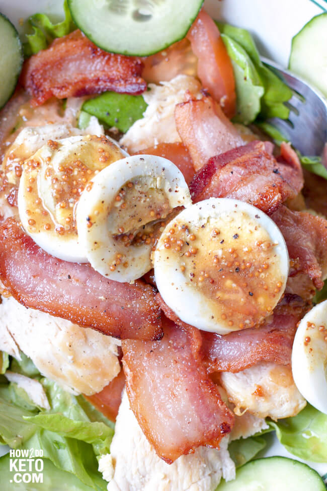 Who needs bread?? This Keto Chicken BLT Salad has all the good stuff...without all the carbs! Topped with a tangy mustard vinaigrette - this salad rocks!!