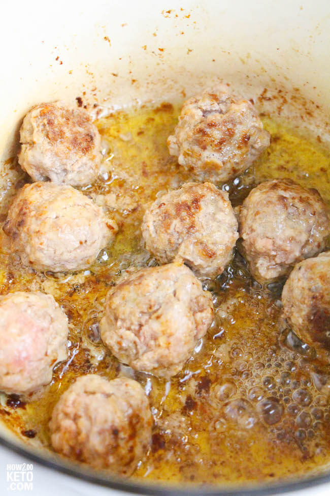 Meatballs cooking in a dutch oven