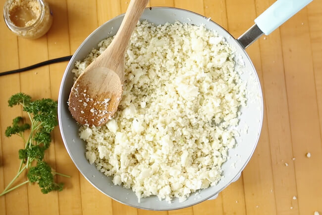 cooking cauliflower rice in sauté pan