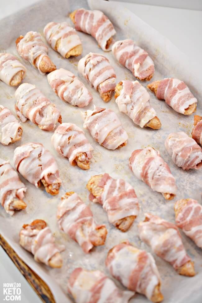 Keto chicken wings wrapped in bacon.