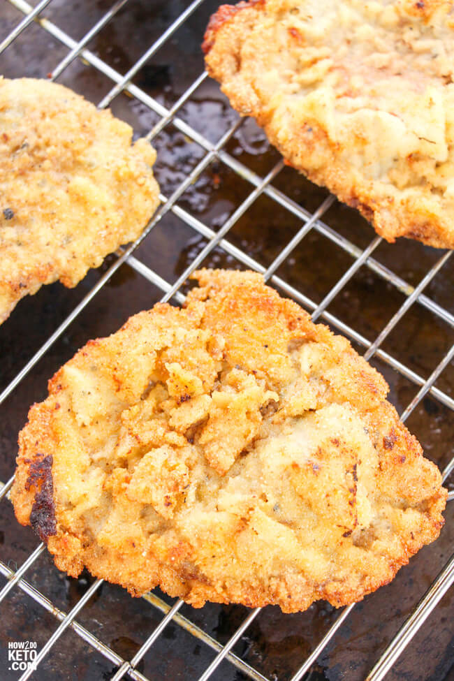 chicken fried steak on a wire cooling rack