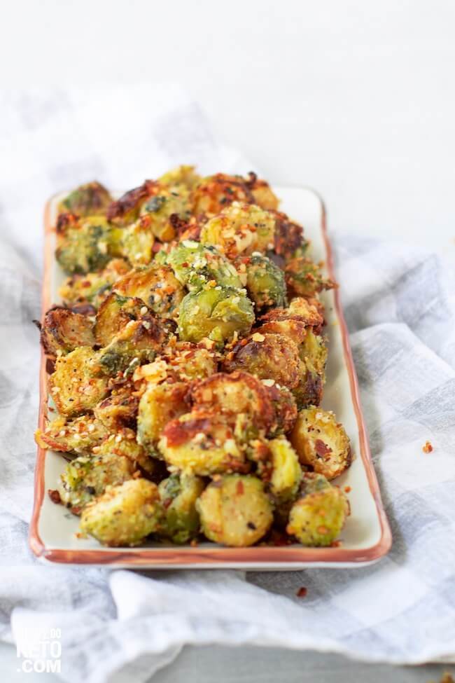 seasoned fried brussel sprouts on serving plate