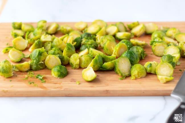 sliced Brussels sprouts on cutting board
