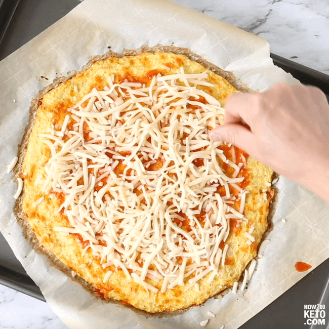 Yes, you can still have pizza on a low carb diet! This cheesy Keto Cauliflower Pizza Crust might just be better than the real thing!