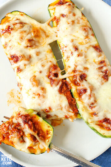 keto zucchini boats stuffed with meat, pizza sauce, and cheese