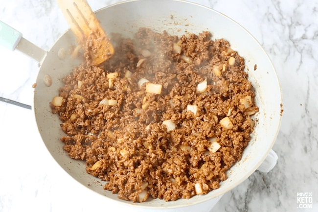 cooking ground beef and onions in pan