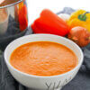 bowl of roasted red pepper soup with veggies