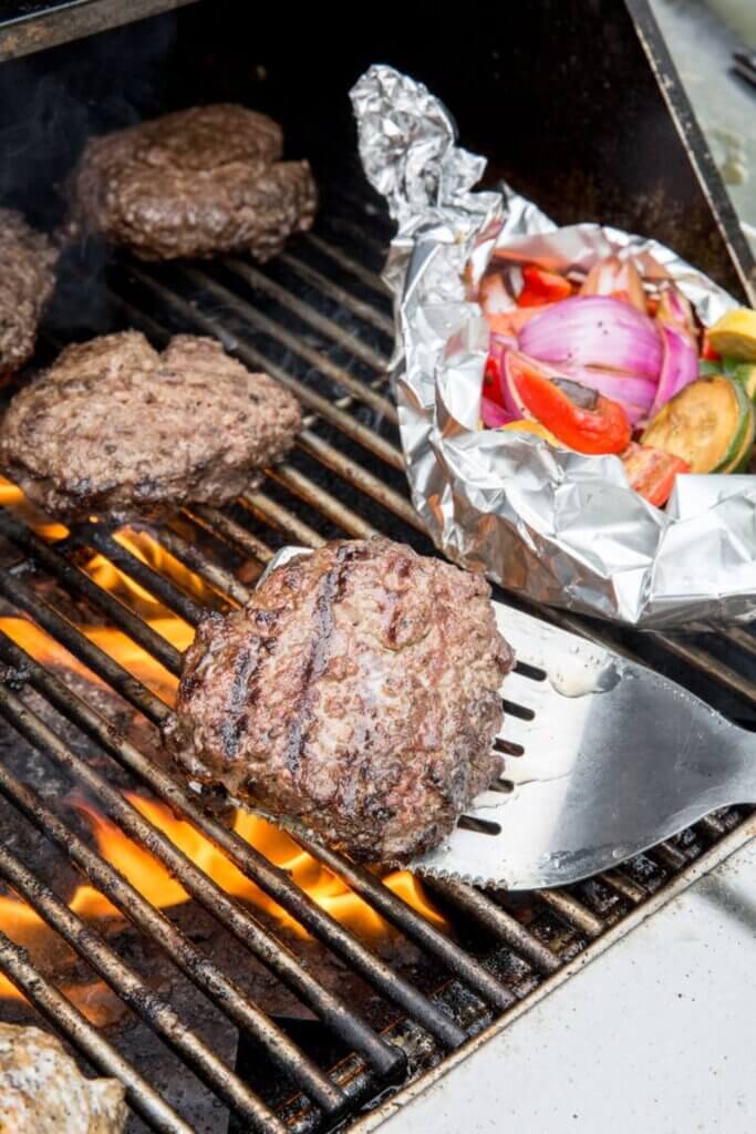 cooking burgers on the grill