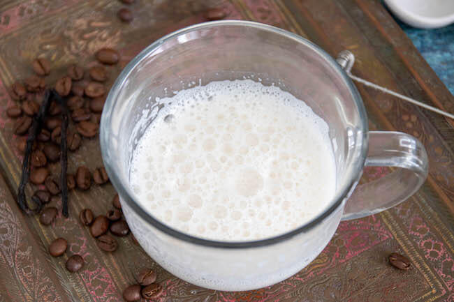 almond milk in clear mug