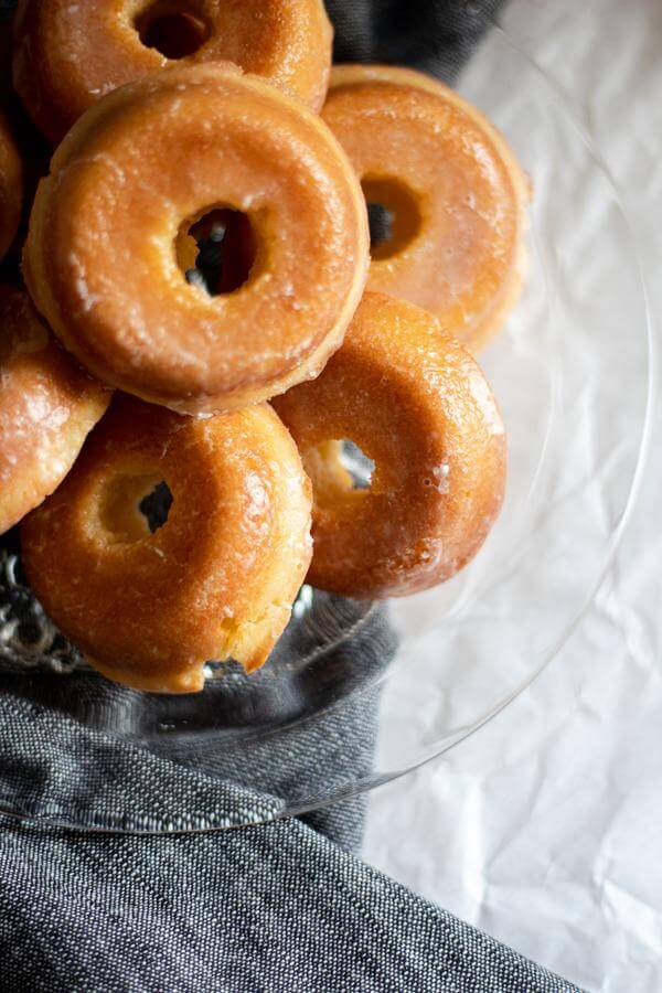 homemade donuts on glass plate