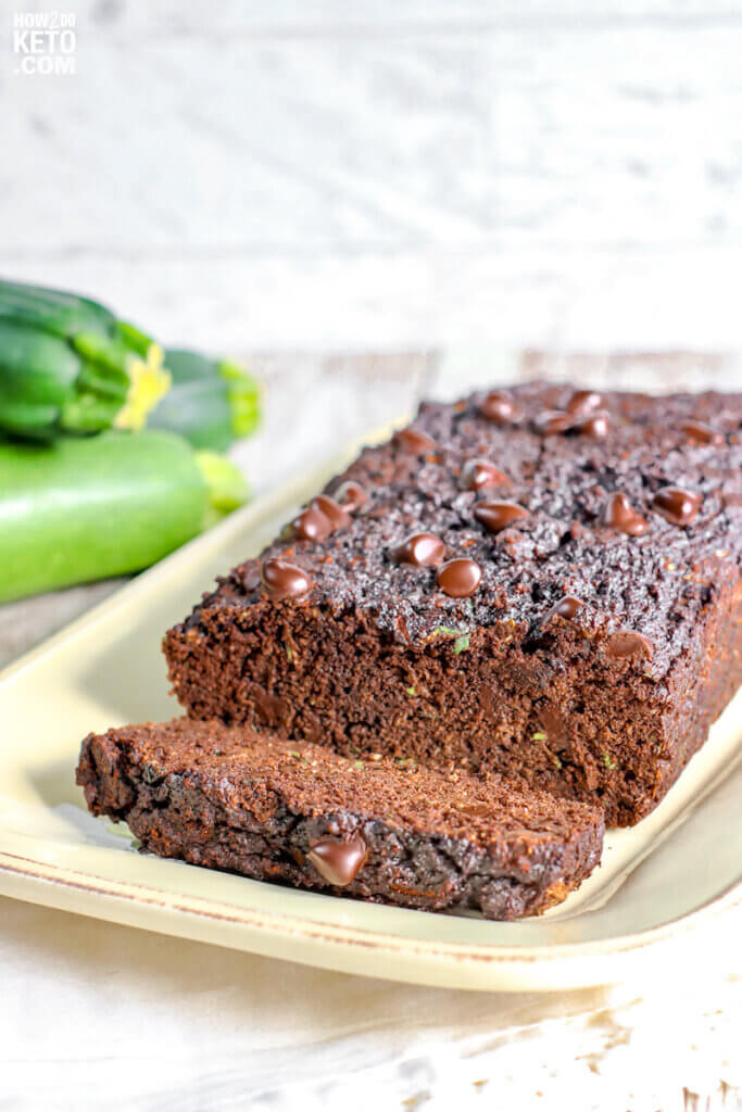 sliced loaf of chocolate zucchini bread on plate