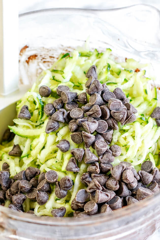 shredded zucchini and chocolate chips in mixing bowl