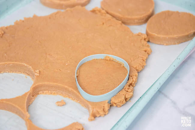 cutting out peanut butter eggs with cookie cutter