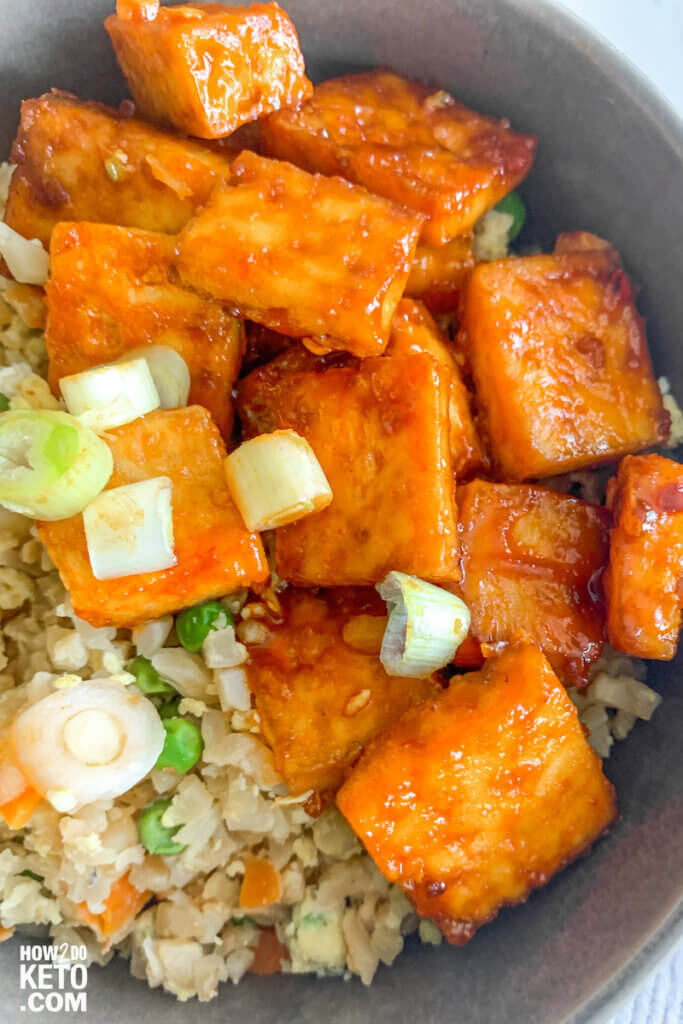 This low carb and vegetarian-friendly Keto Firecracker Tofu & Fried Cauliflower Rice is the perfect way to spice up your keto life!