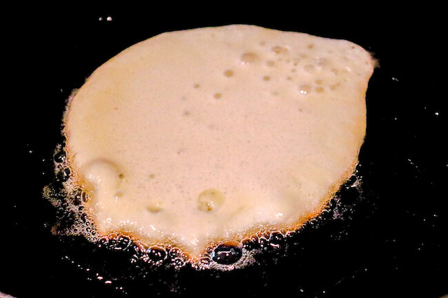 making keto pancakes on griddle