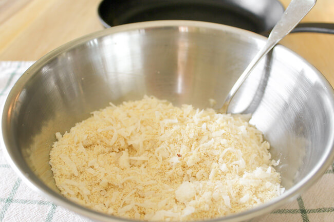 mixing almond flour and shredded coconut in bowl