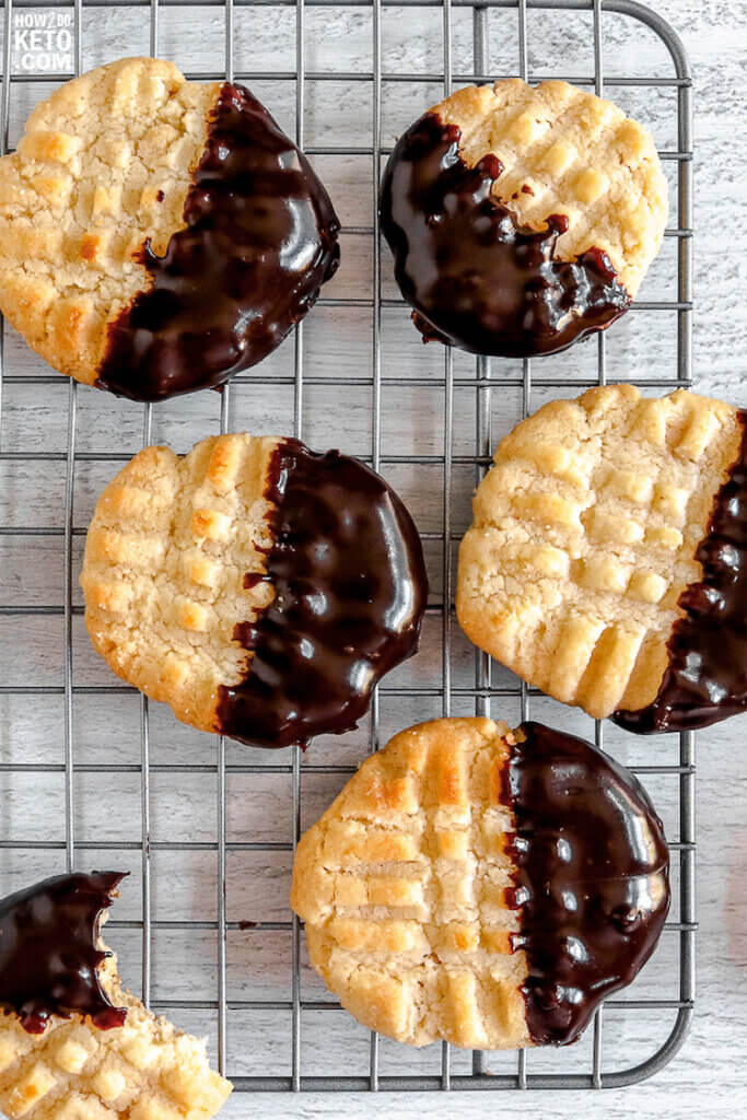 golden brown keto friendly butter cookies dipped in dark chocolate