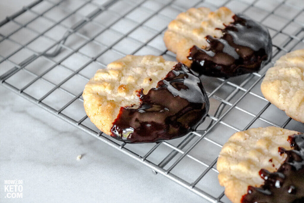 low carb butter cookies with chocolate coating, on wire rack