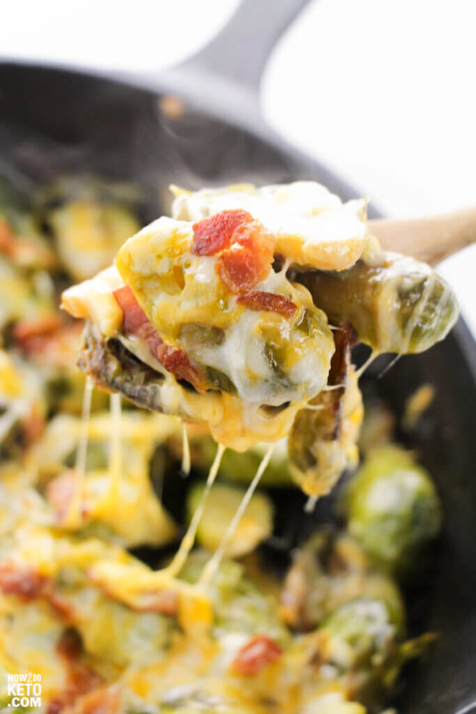 cheesy Brussel sprouts on serving spoon