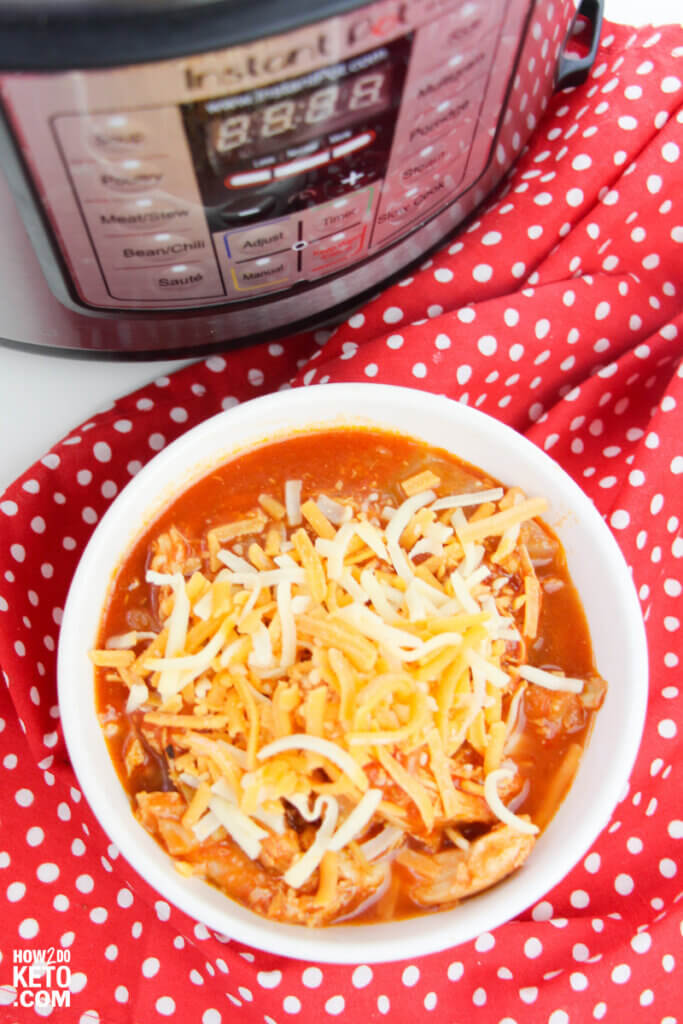 bowl of enchilada soup with Instant Pot in background
