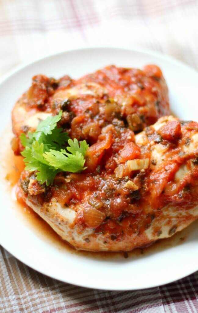 cooked chicken breasts topped with red salsa