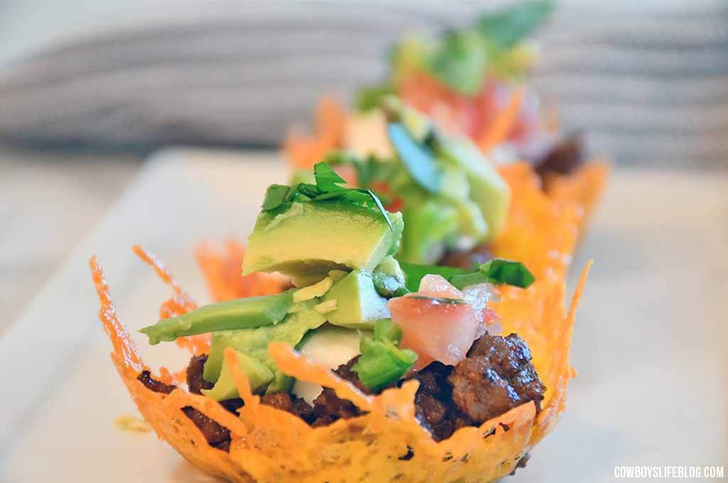keto taco cups made with cheese and filled with meat and salsa