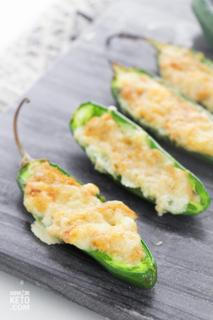 keto jalapeño poppers topped with melted cheese
