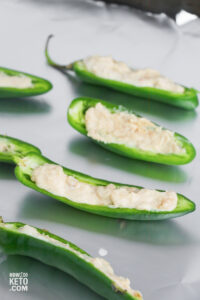 filling jalapeno peppers with cream cheese