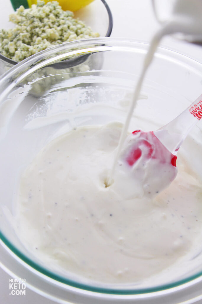 pouring buttermilk into homemade salad dressing
