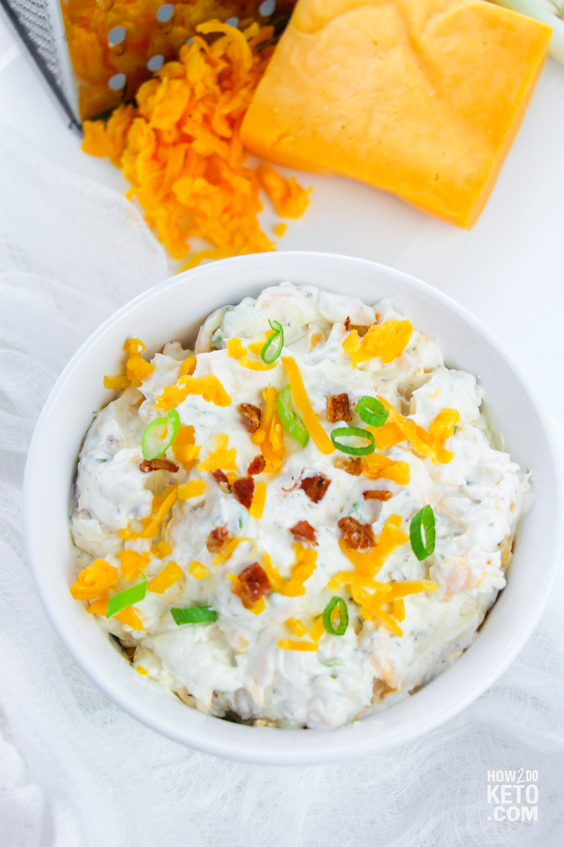 bowl of keto ranch dip with cheese and green onions