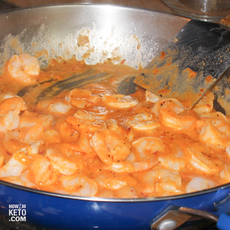 shrimp cooking in a sweet chili sauce on stovetop