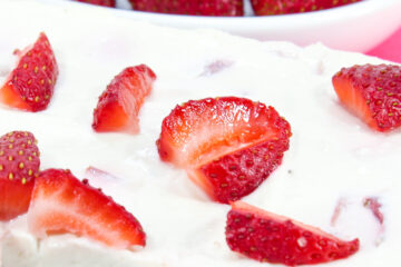close up of a slice of strawberry keto cheesecake