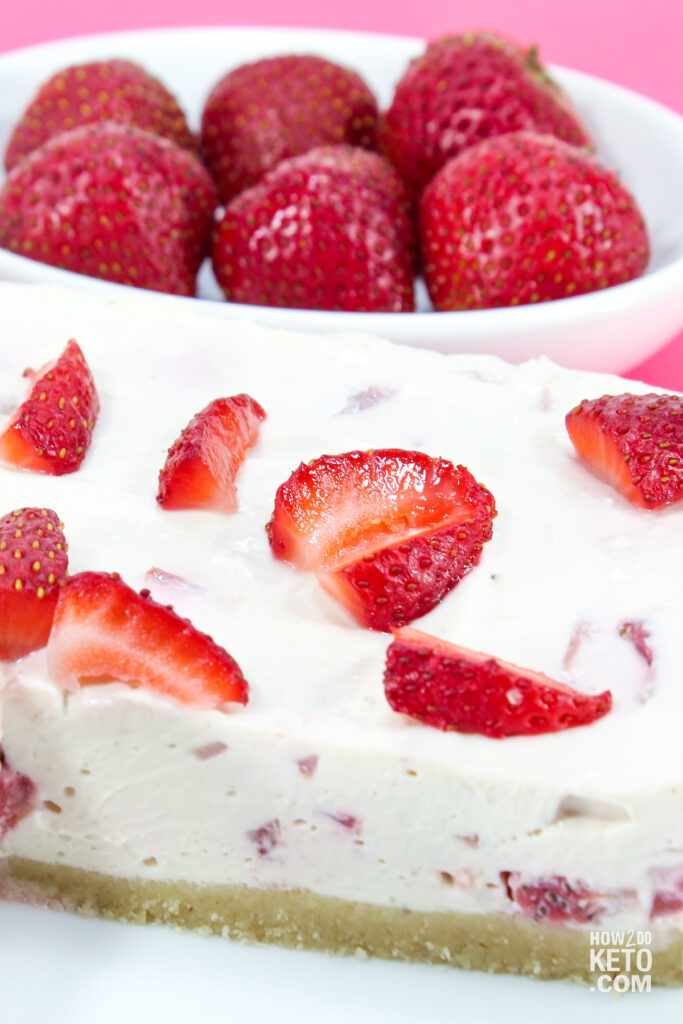 close up of a slice of low carb strawberry cheesecake 