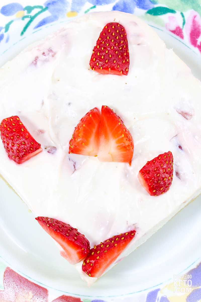top down close up shot of a slice of keto strawberry cheesecake