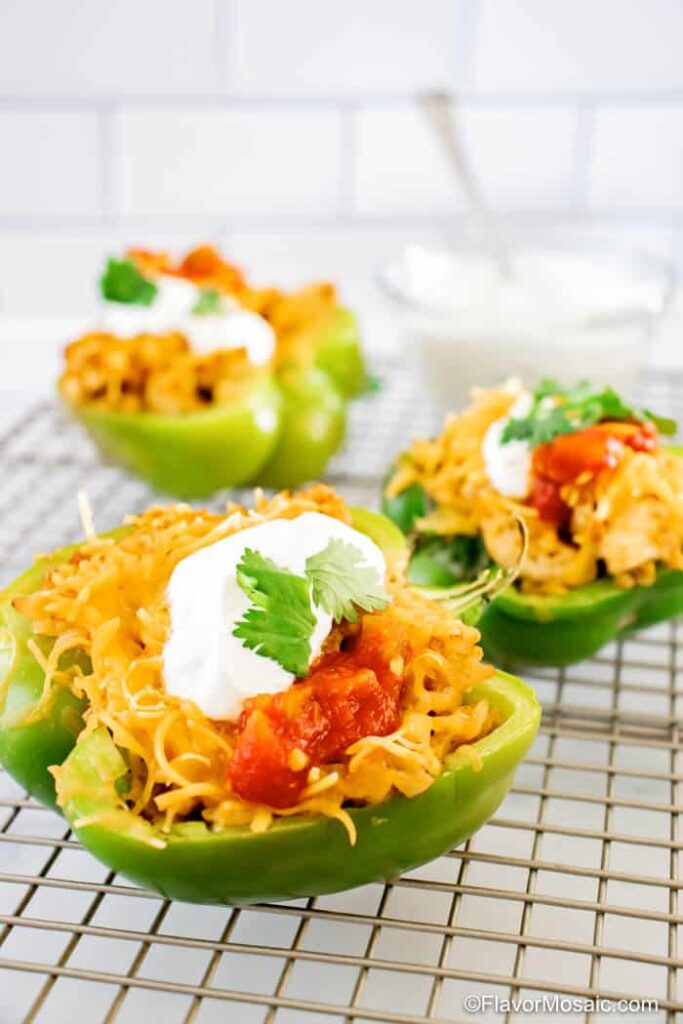 green bell peppers stuffed with cheese, salsa, and sour cream