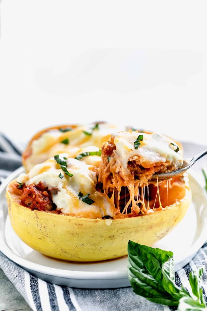 spaghetti squash shell stuffed with pasta sauce and cheese