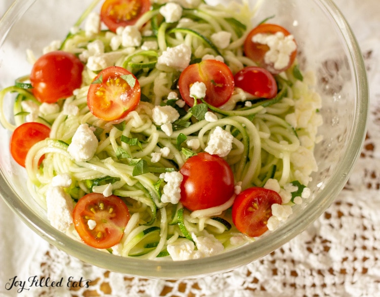 cold noodle salad made with zucchini noodles and grape tomatoes