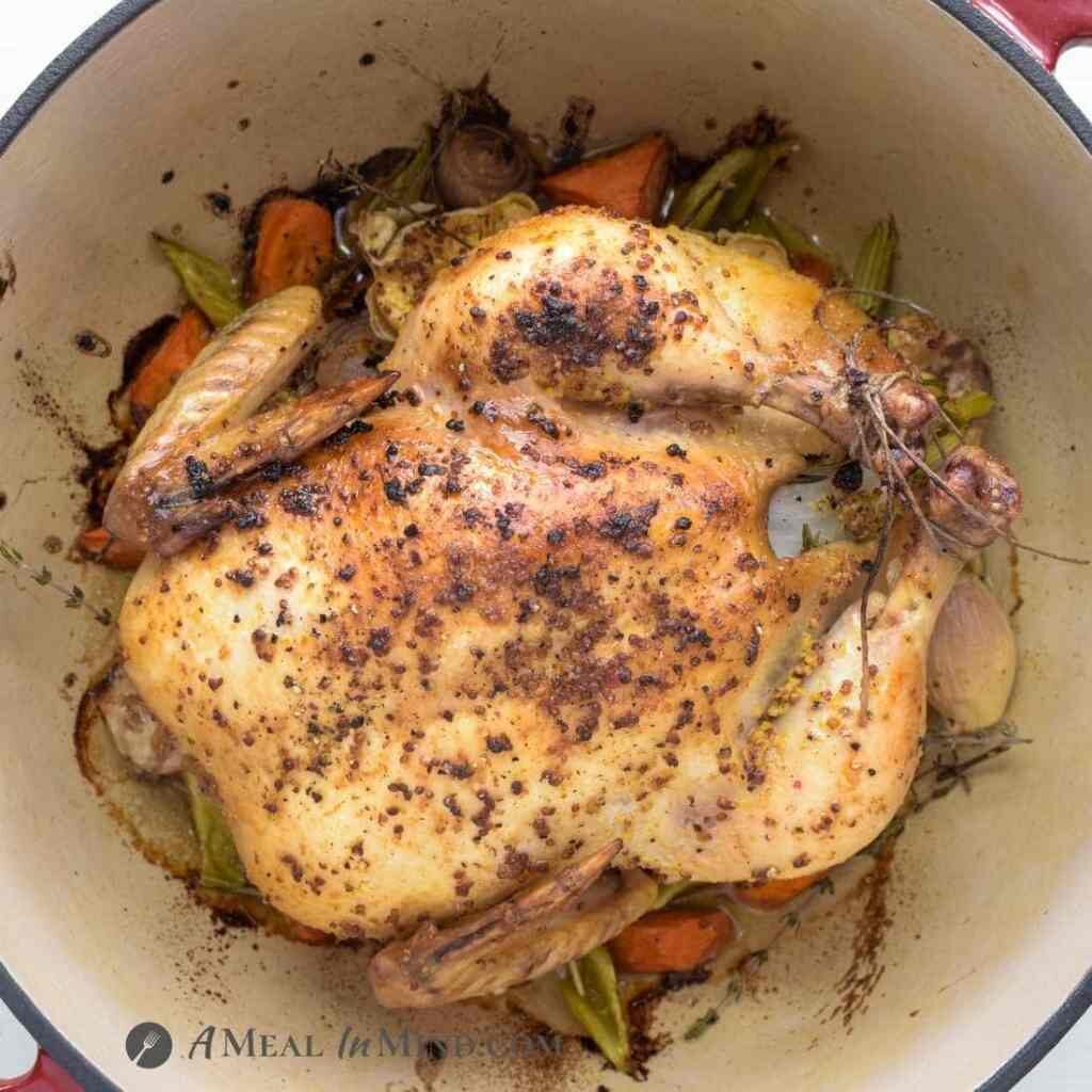 roast chicken in Dutch oven with carrots