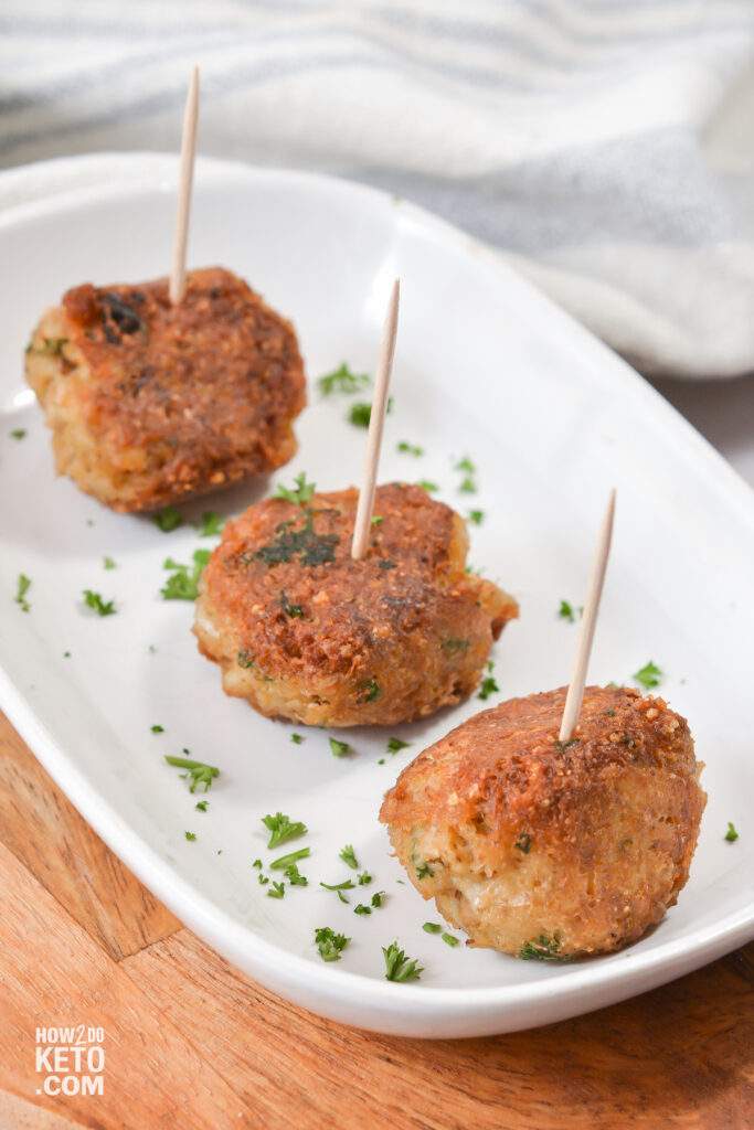 Mini Keto Crab Cakes with toothpicks in them