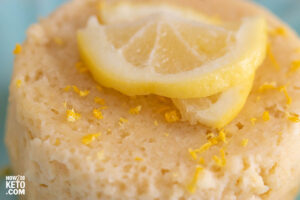 close up of a lemon cake with lemon slice on top