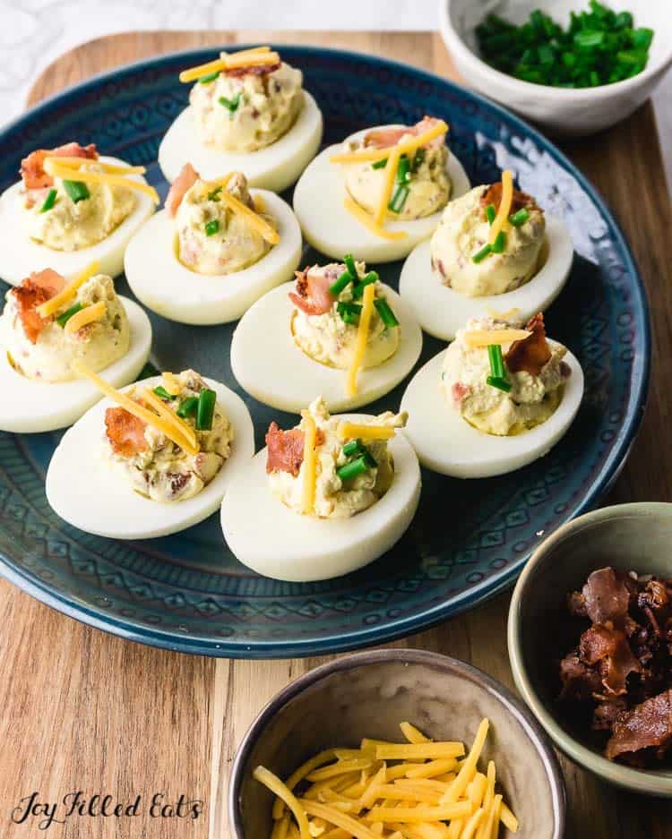 deviled eggs with bacon, green onion, and cheddar