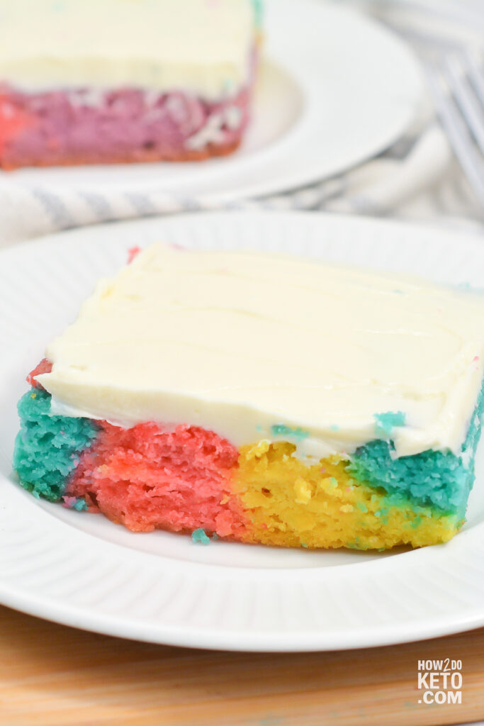 A slice of keto tie dye cake, with cream cheese icing