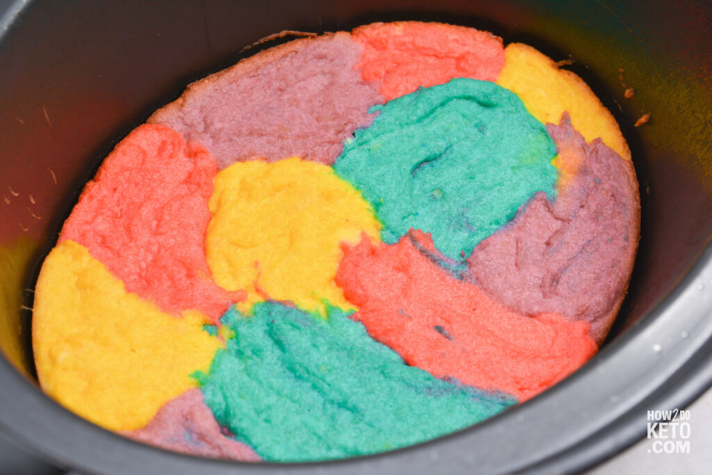 keto tie dye cake baking in a crockpot