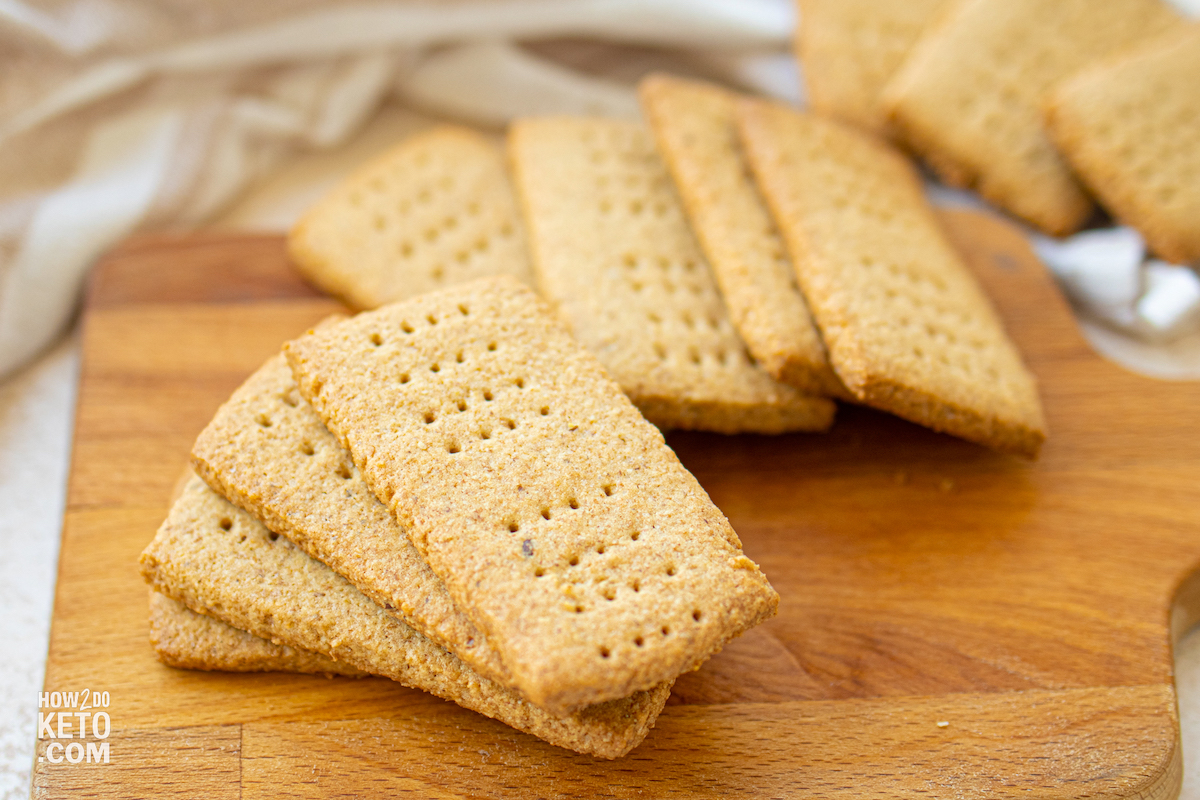 homemade graham crackers on wooden cutting board.